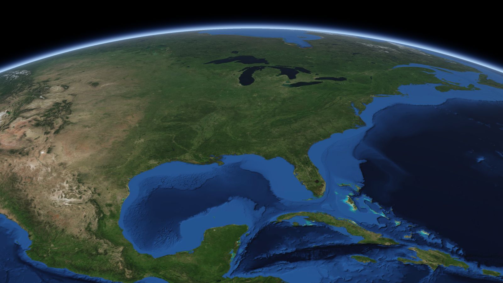 The curve of the Earth seen from orbit, with Huntsville ringed in amber near the middle of the picture.