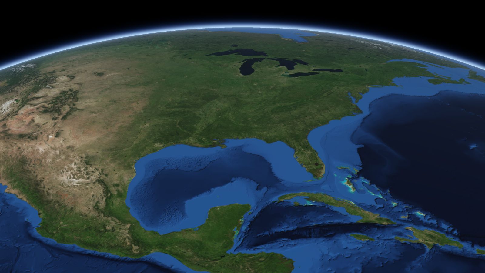 The curve of the Earth seen from orbit, with Tuscaloosa ringed in amber near the middle of the picture.