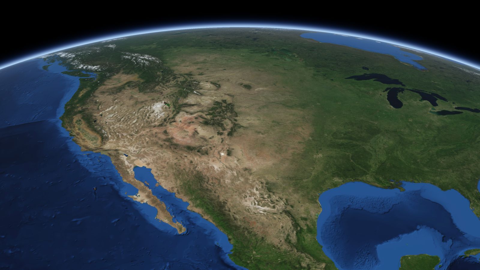 The curve of the Earth seen from orbit, with Pueblo ringed in amber near the middle of the picture.