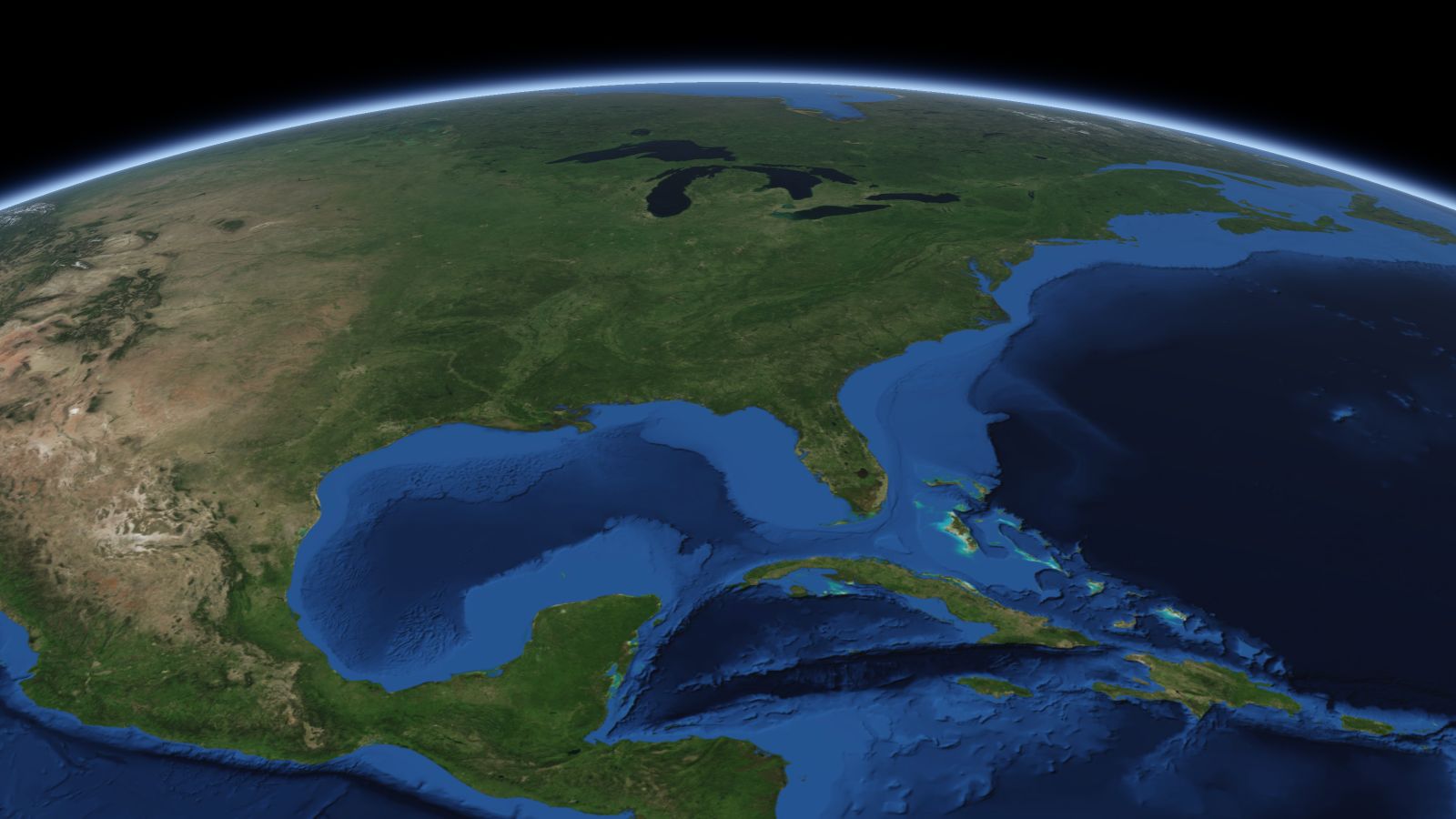 The curve of the Earth seen from orbit, with Columbus ringed in amber near the middle of the picture.