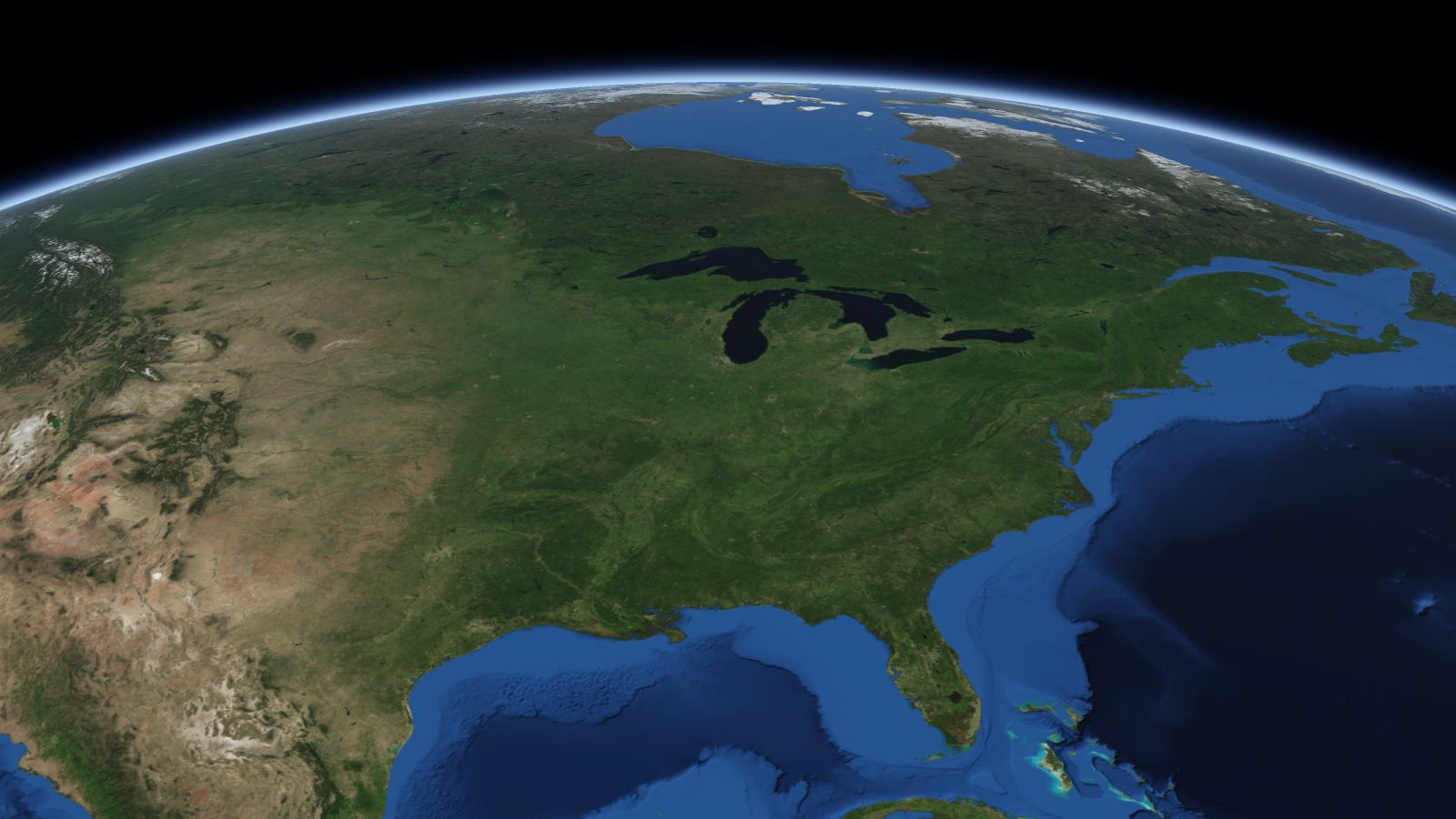 The curve of the Earth seen from orbit, with Chicago ringed in amber near the middle of the picture.