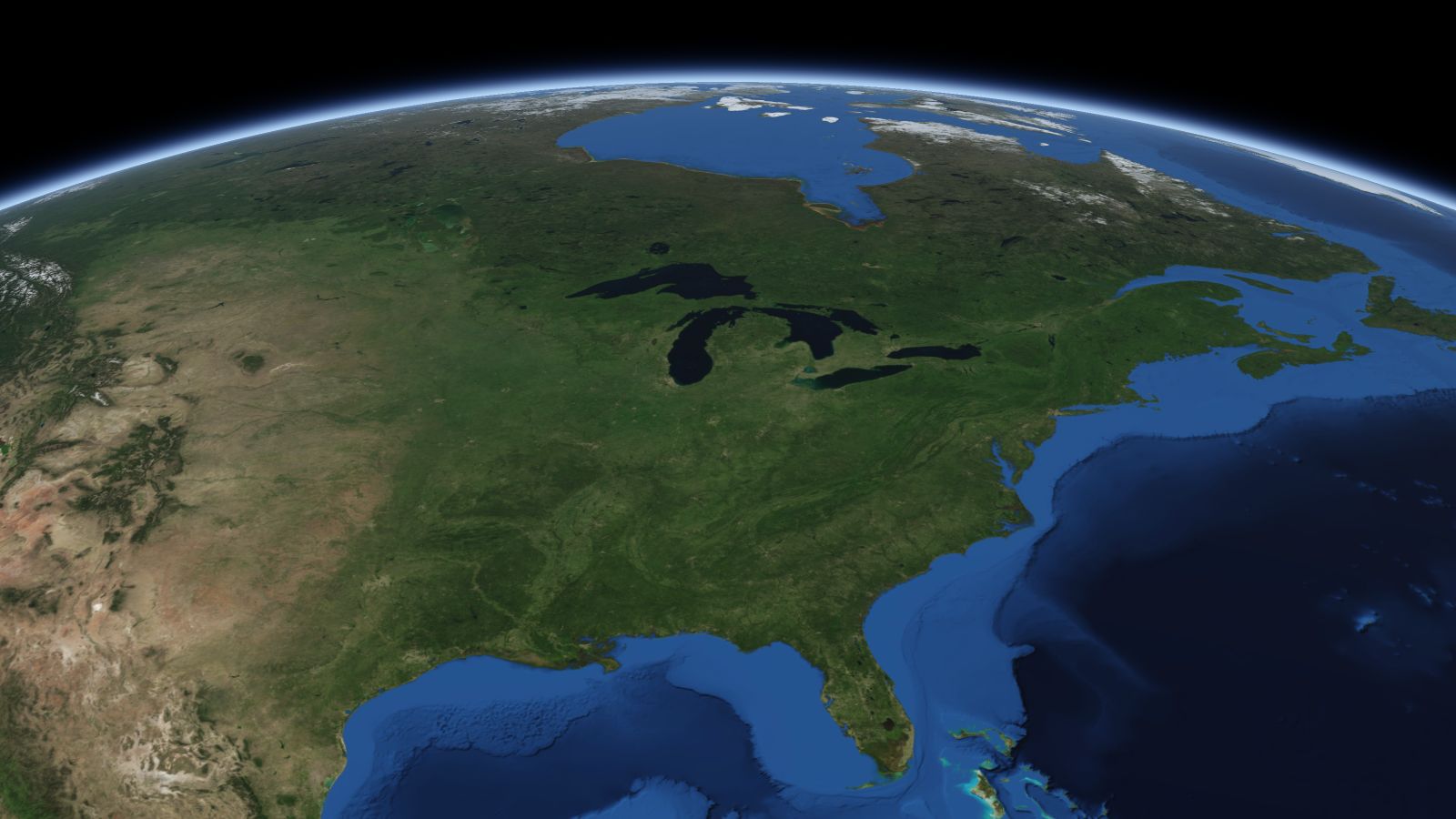 The curve of the Earth seen from orbit, with Grand Rapids ringed in amber near the middle of the picture.