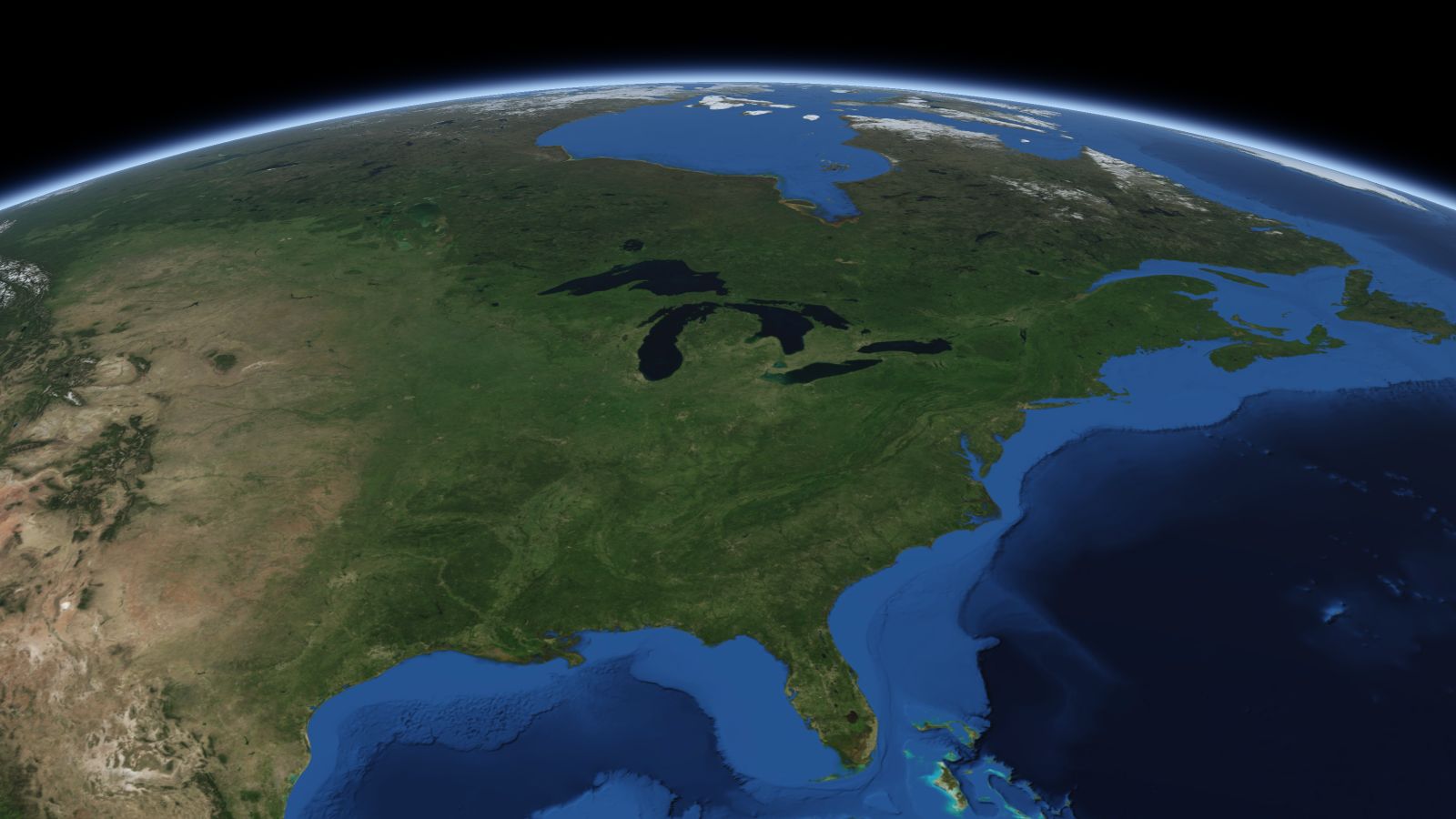 The curve of the Earth seen from orbit, with Lansing ringed in amber near the middle of the picture.