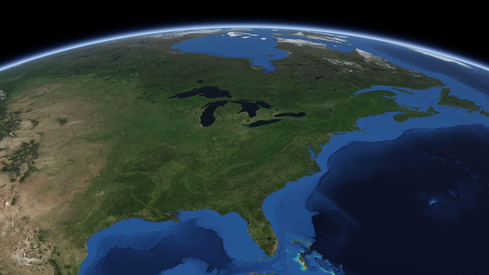 The curve of the Earth seen from orbit, with Warren ringed in amber near the middle of the picture.