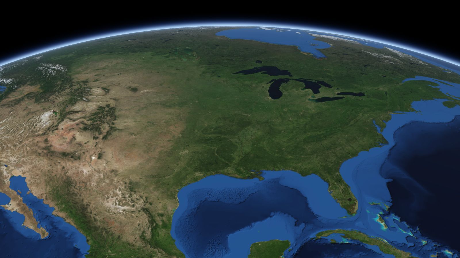 The curve of the Earth seen from orbit, with Columbia ringed in amber near the middle of the picture.