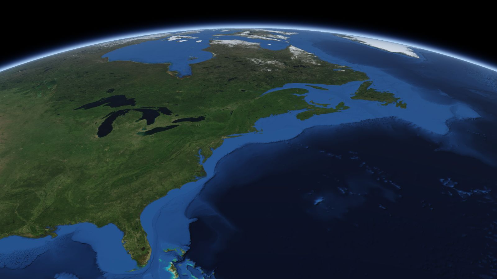 The curve of the Earth seen from orbit, with Manchester ringed in amber near the middle of the picture.