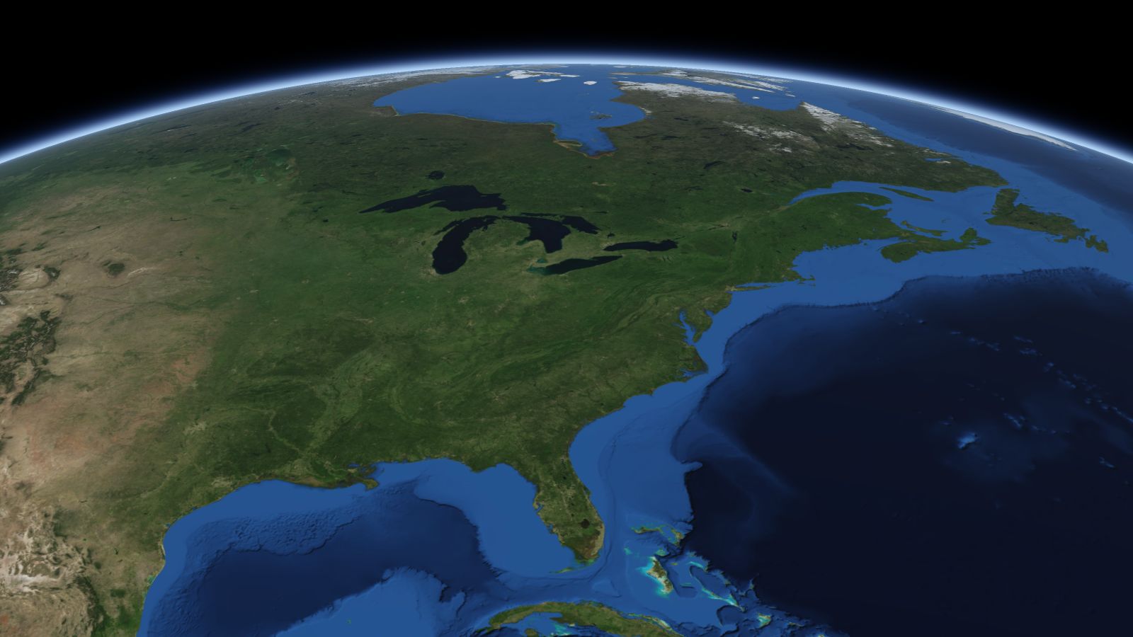 The curve of the Earth seen from orbit, with Akron ringed in amber near the middle of the picture.