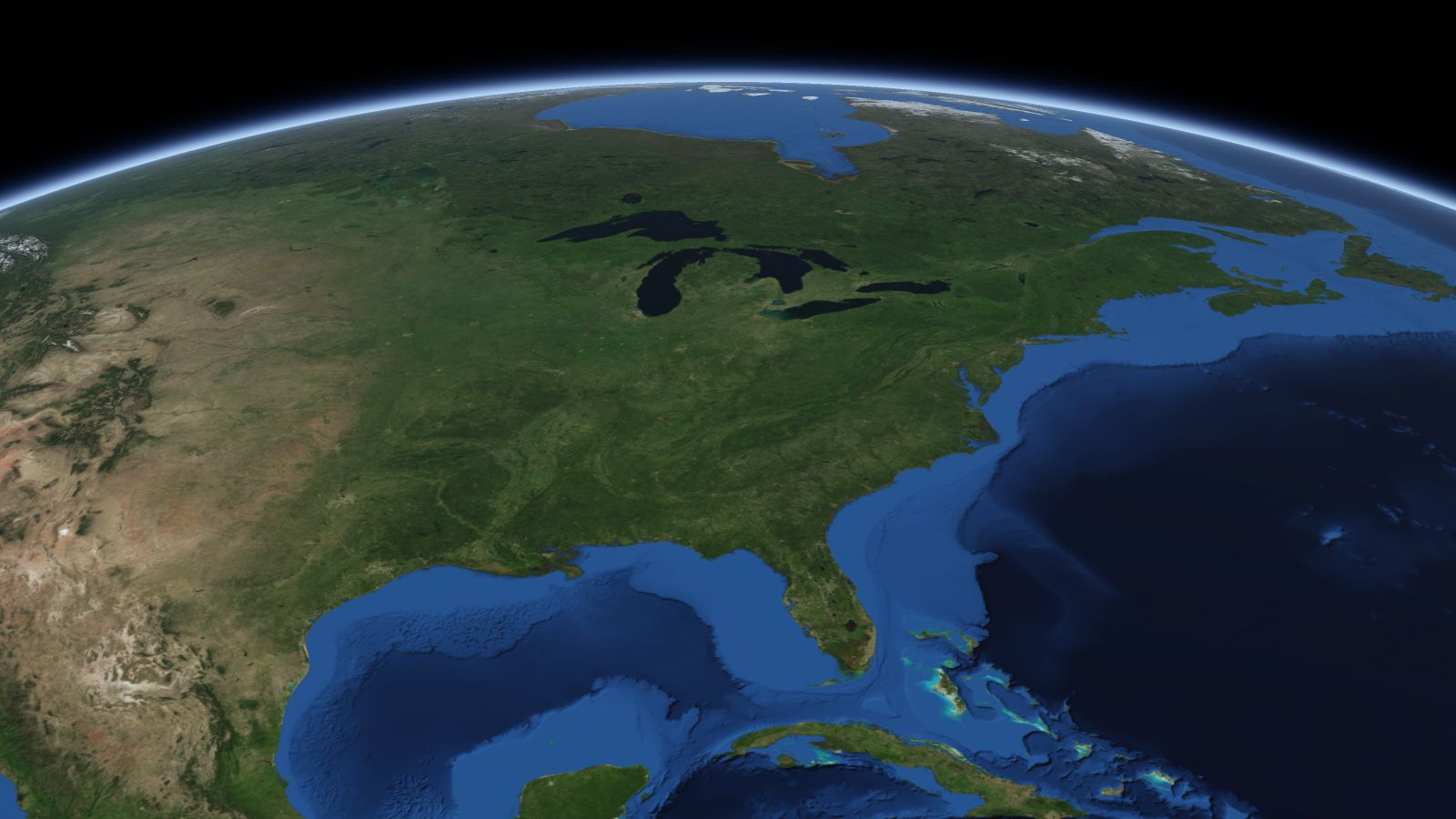 The curve of the Earth seen from orbit, with Cincinnati ringed in amber near the middle of the picture.
