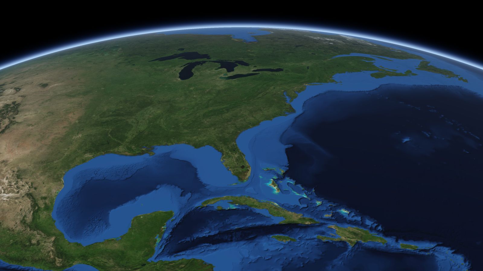 The curve of the Earth seen from orbit, with Columbia ringed in amber near the middle of the picture.