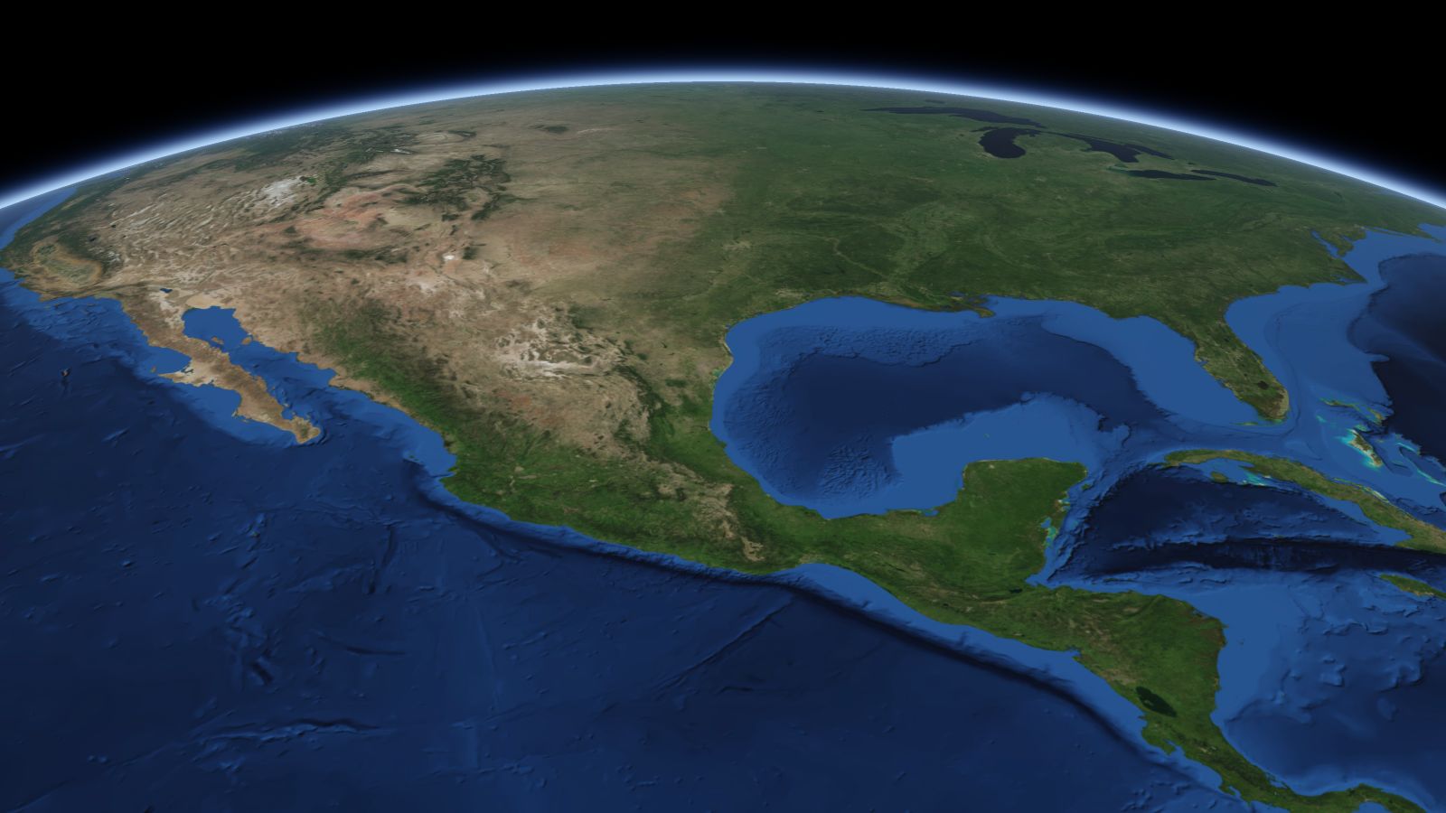 The curve of the Earth seen from orbit, with Brownsville ringed in amber near the middle of the picture.