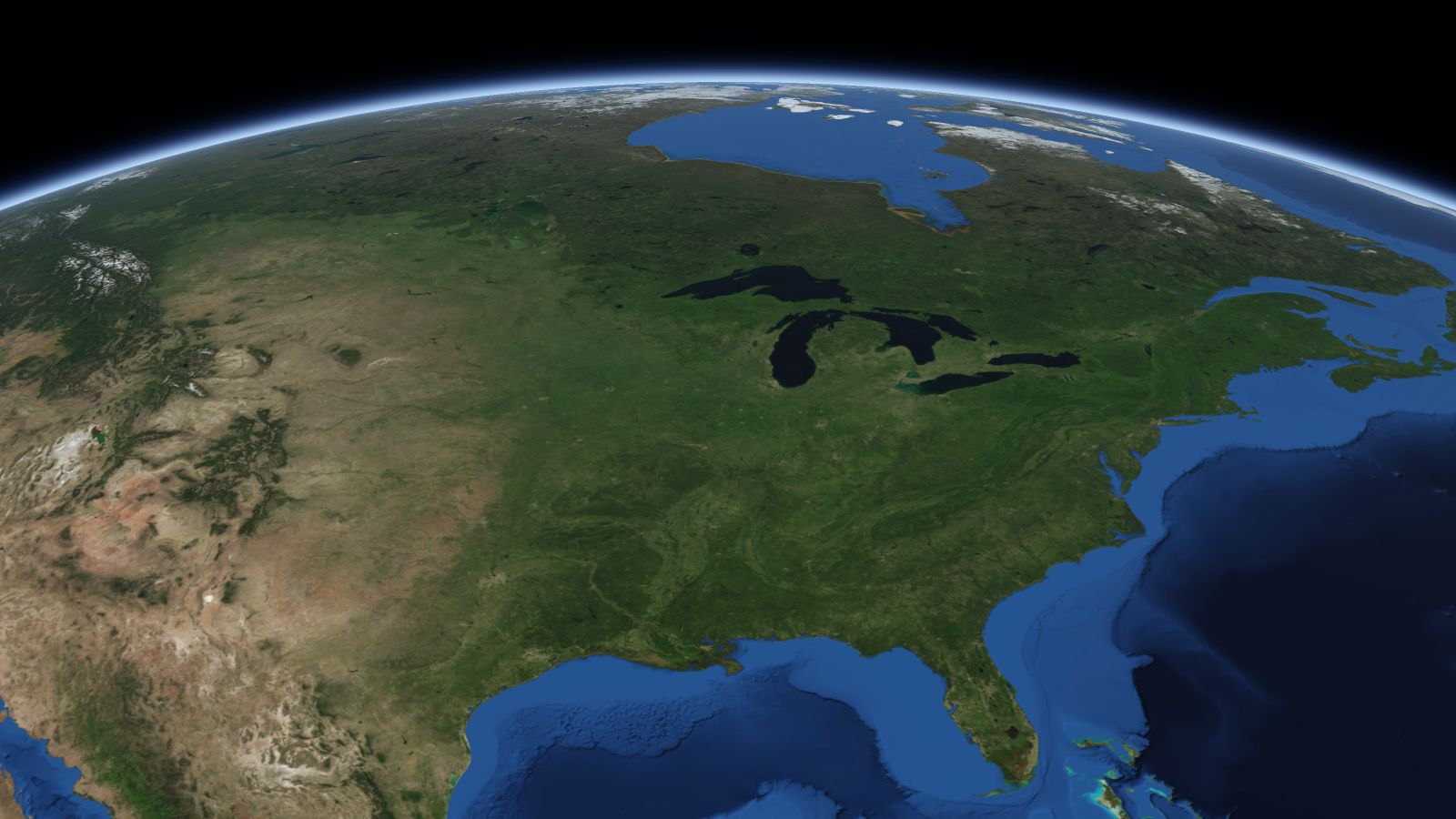 The curve of the Earth seen from orbit, with Madison ringed in amber near the middle of the picture.