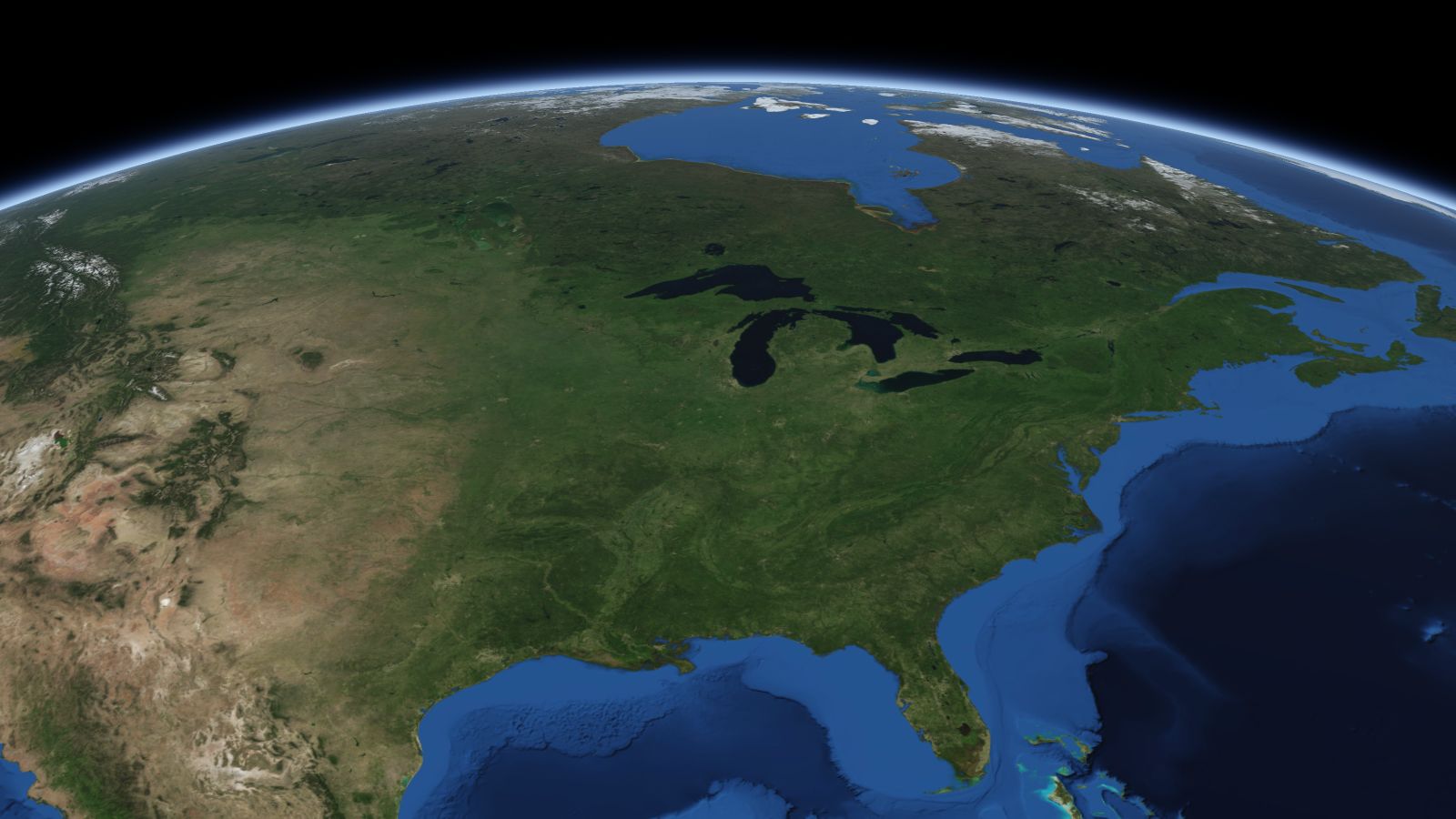 The curve of the Earth seen from orbit, with Milwaukee ringed in amber near the middle of the picture.